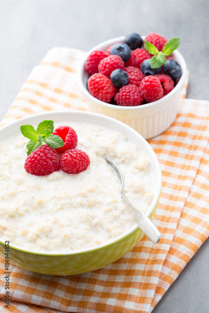 Oatmeal porridge in bowl with berries raspberries and blackberri Oatmeal porridge in bowl with berries raspberries and blackberri