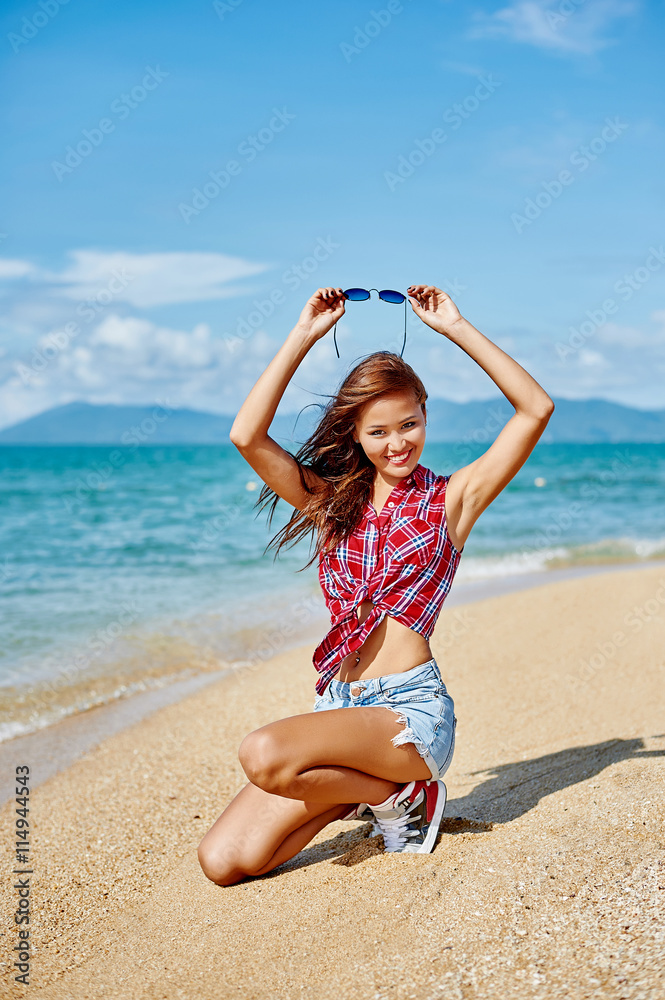Outdoor summer portrait of young pretty asian woman having fun a Outdoor summer portrait of young pretty asian woman having fun a