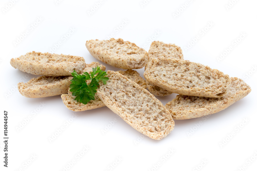 Dry flat bread crisps with herbs on a white background. Dry flat bread crisps with herbs on a white background.