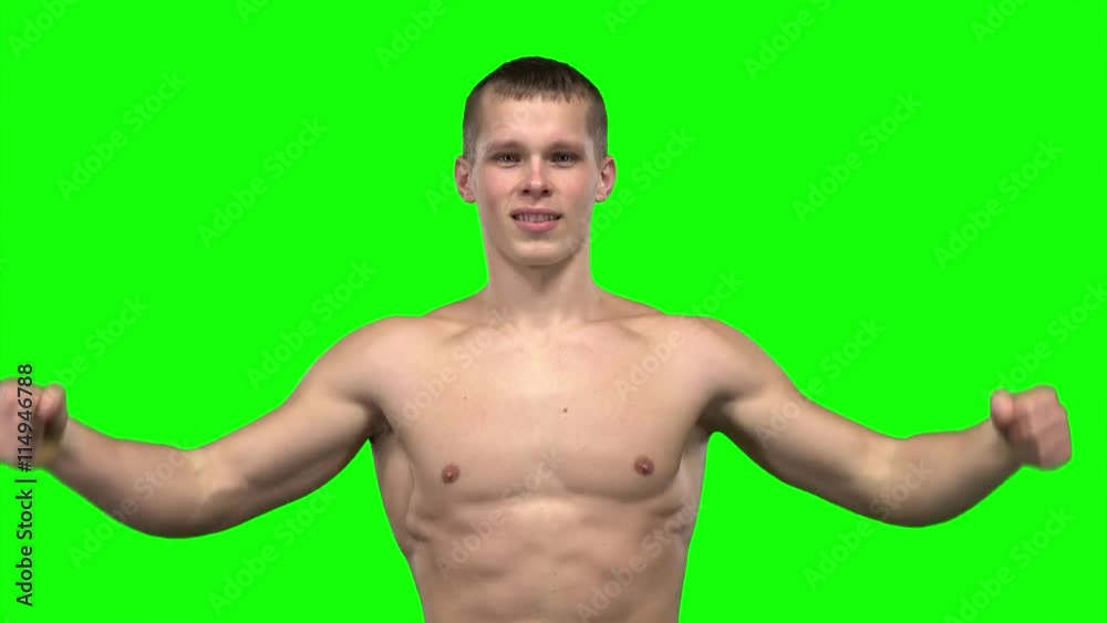 Man is posing and shows his muscles. Green screen Man is posing and shows his muscles. Green screen