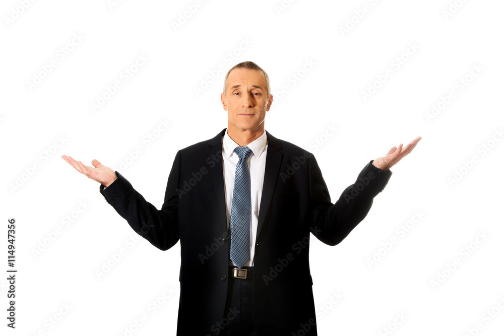 Businessman with open hands in undecided gesture Businessman with open hands in undecided gesture