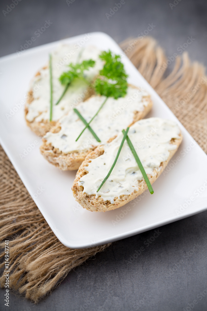 Crispbread with soft cheese with herbs and bacon. Crispbread with soft cheese with herbs and bacon.