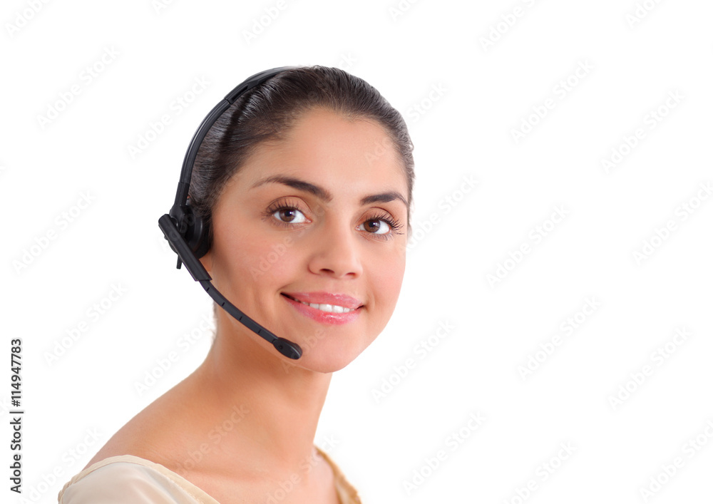 Portrait of beautiful business woman working at her desk with headset and laptop Portrait of beautiful business woman working at her desk with headset and laptop