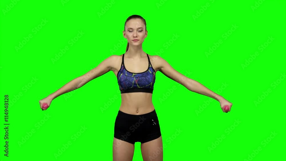 Woman doing exercises with dumbbells. Green screen Woman doing exercises with dumbbells. Green screen
