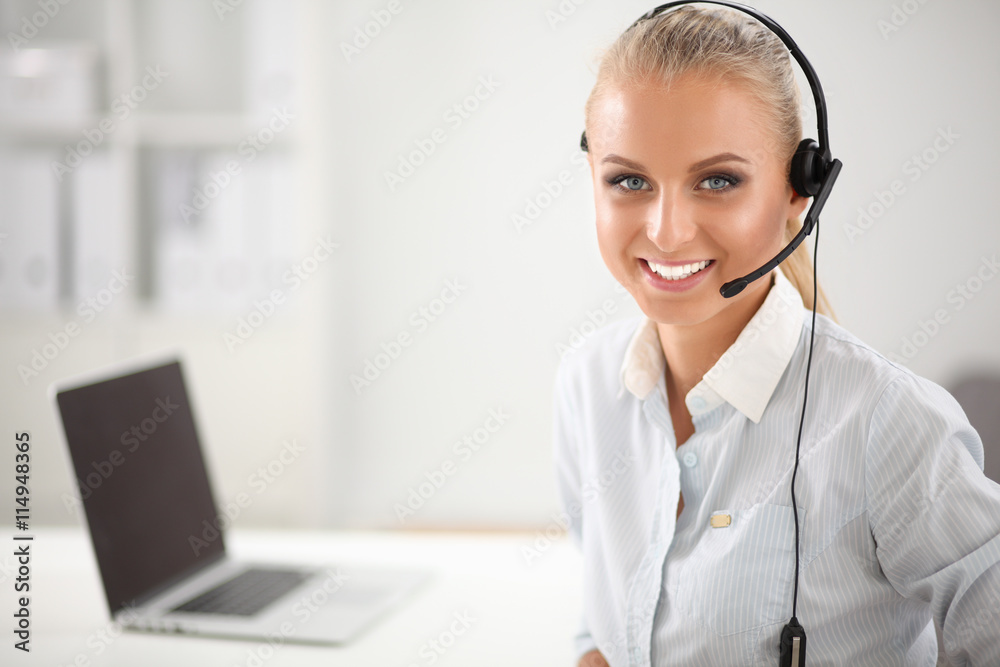 Close-up portrait of a customer service agent sitting at office Close-up portrait of a customer service agent sitting at office