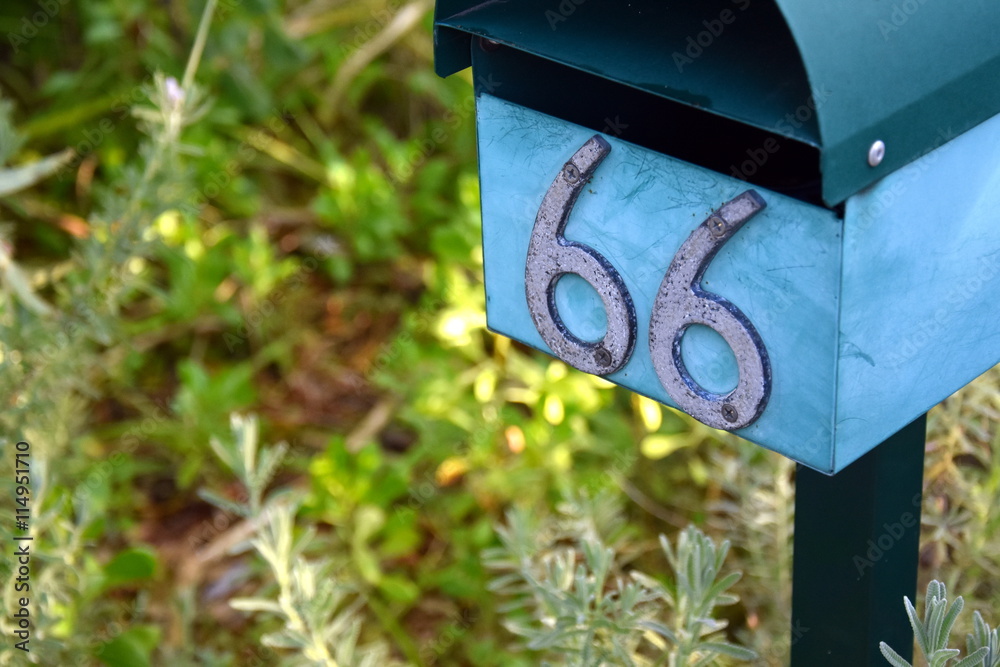 Fototapeta premium Rural letterbox with number 66