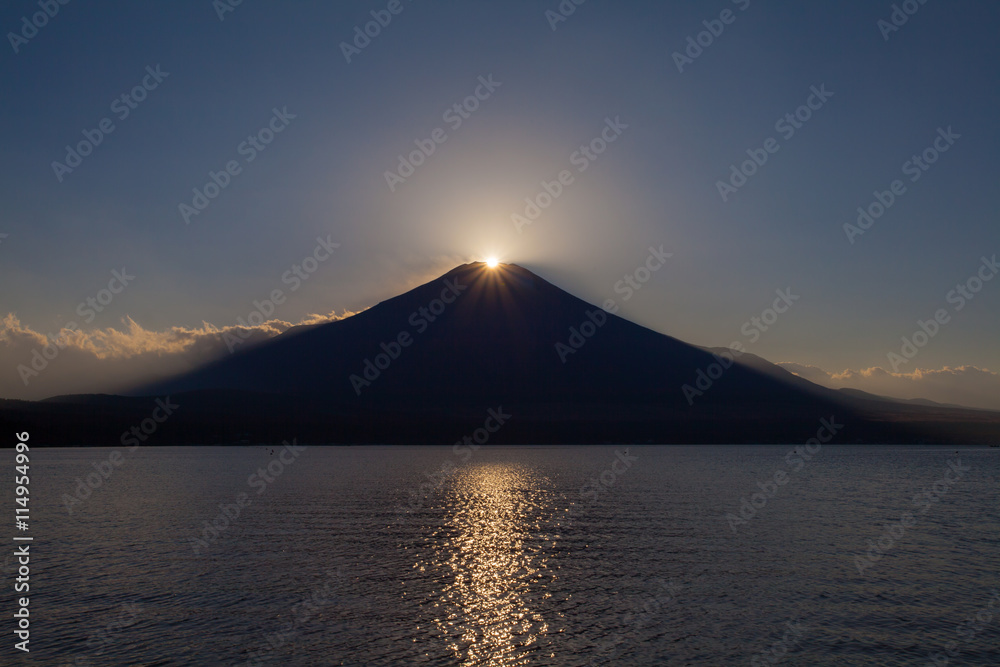 Fuji diamond , Sunset on Top of Mountain Fuji and refection at Lake Yamanakako in autumn season Fuji diamond , Sunset on Top of Mountain Fuji and refection at Lake Yamanakako in autumn season