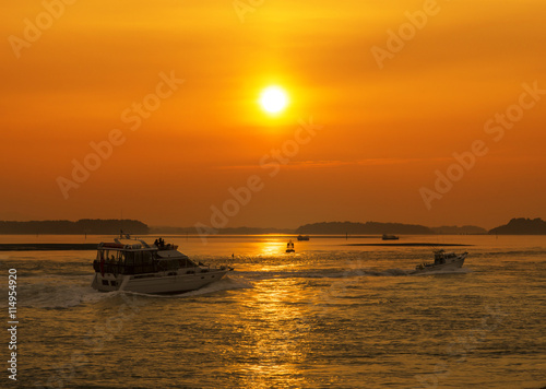 Sunset over Boats in Poole Harbour © allouphoto