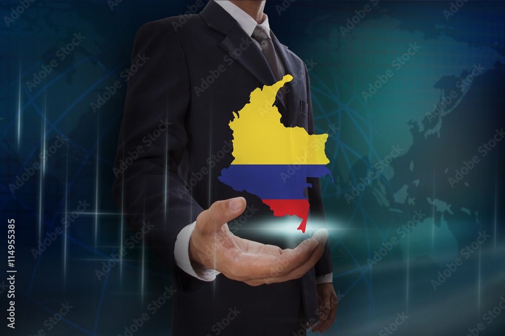 Businessman showing map of Colombia on globe background
