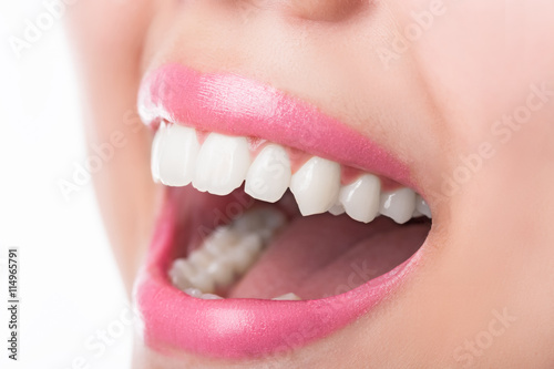 Close up young woman smiling white glamour teeth.