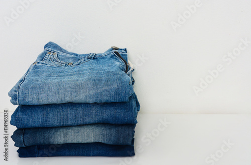 stack of jeans isolated on white