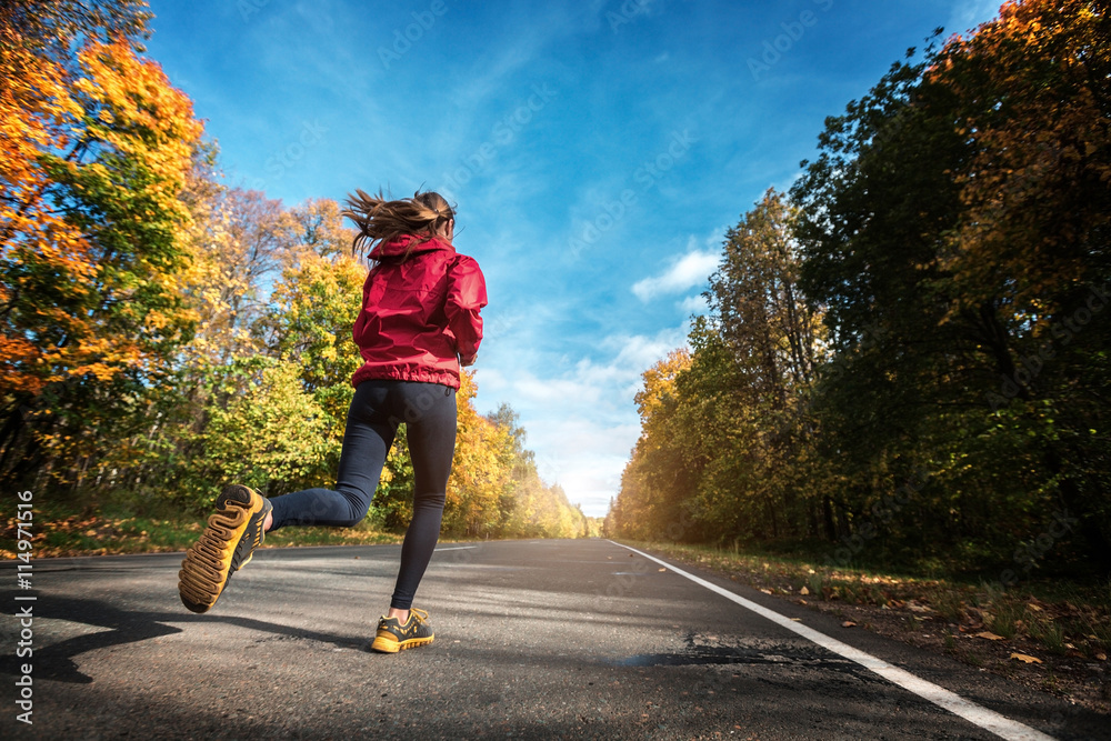 Fototapeta premium Lady runs on the road