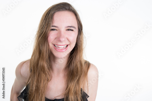 Laughing Young cute smiling girl isolated on white