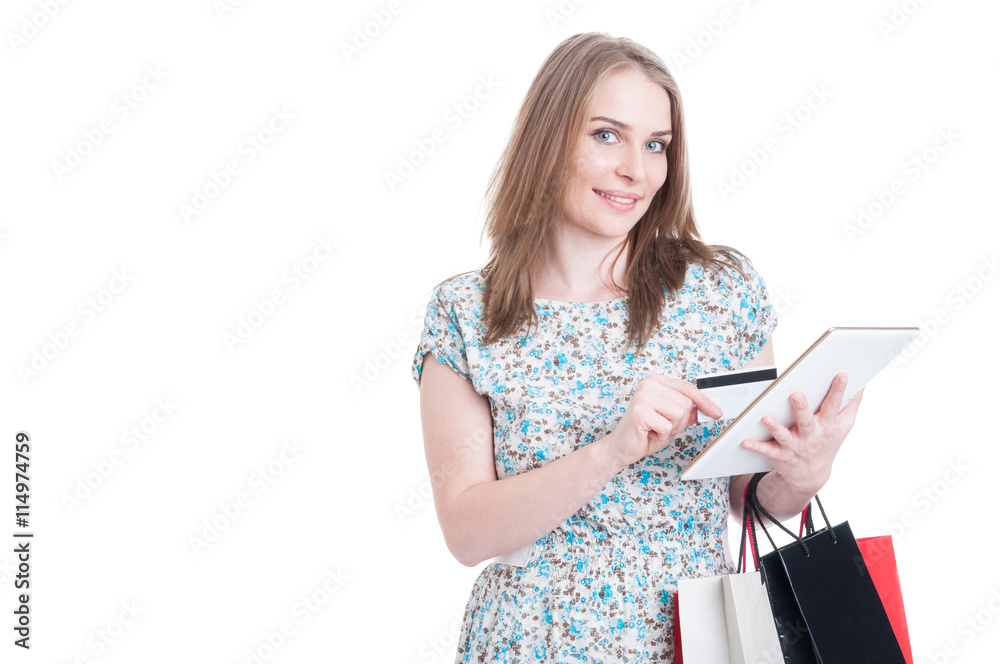 Smiling customer with credit card, bags and tablet Smiling customer with credit card, bags and tablet