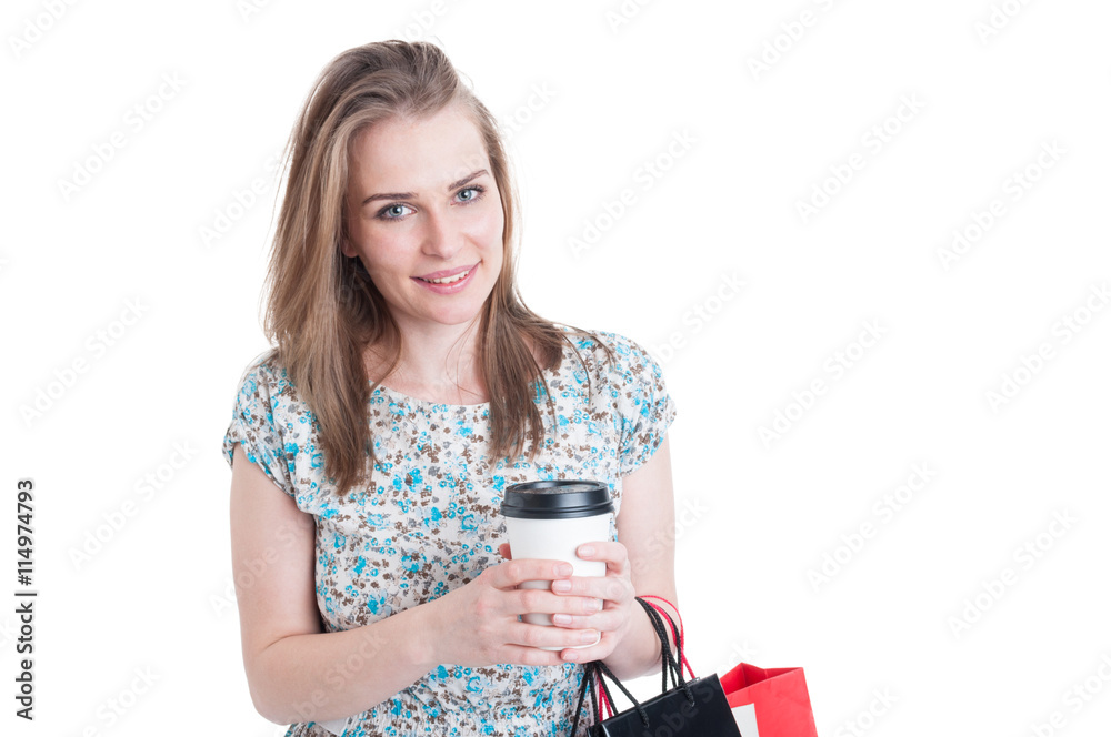 Smiling beautiful shopper with bags enjoying coffee Smiling beautiful shopper with bags enjoying coffee