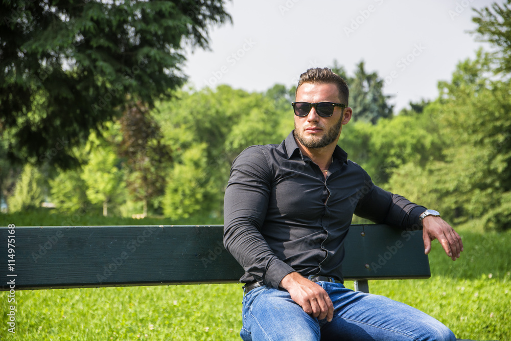 Handsome Muscular Hunk Man Outdoor in City Park Handsome Muscular Hunk Man Outdoor in City Park