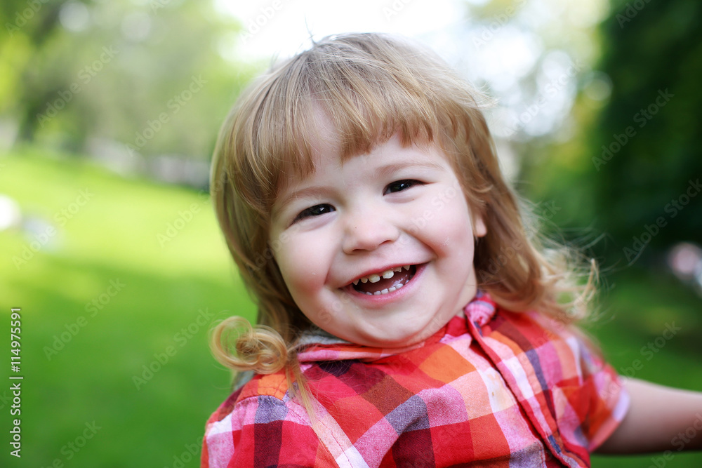 happy small boy on green natural background happy small boy on green natural background