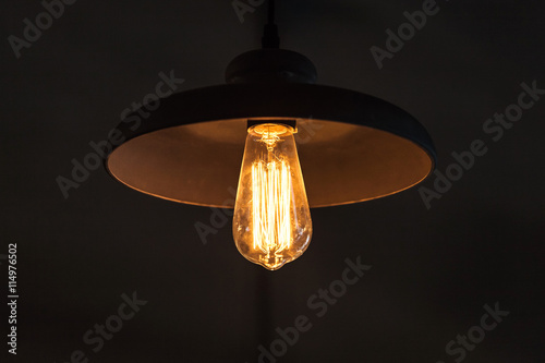 Billede på lærred Retro tungsten lamp in the round lampshade