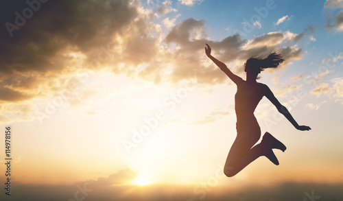 Young woman enjoying outdoors, sky background