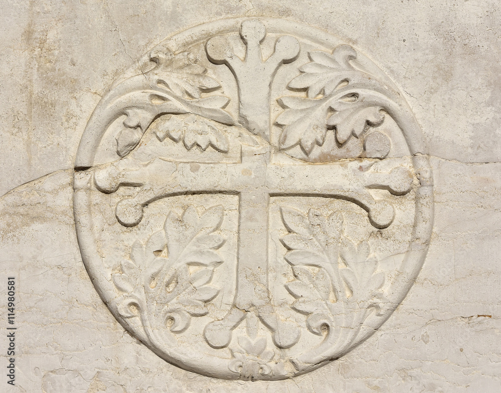 Medieval cross with leaves in Venice, from an ancient sarcophagus on St John and Paul gothic facade, in Venice Medieval cross with leaves in Venice, from an ancient sarcophagus on St John and Paul gothic facade, in Venice