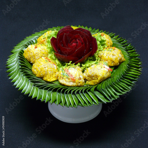 authentic thai food appetizer - rhoom - minced pork and shrimp wrapped in egg-nest photo