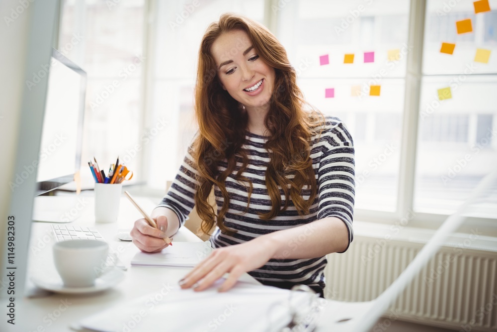 Young businesswoman working in creative office Young businesswoman working in creative office