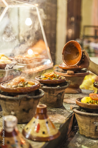 Fototapeta Naklejka Na Ścianę i Meble -  Selection of very colorful Moroccan tajines (traditional cassero