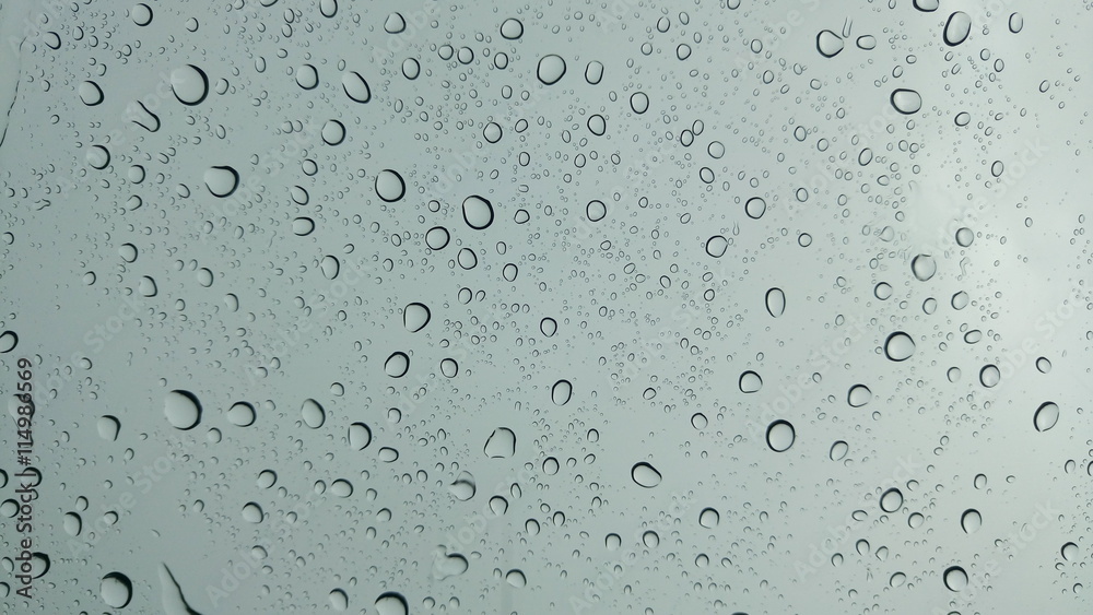 Drops of water on glass in rainy season Drops of water on glass in rainy season