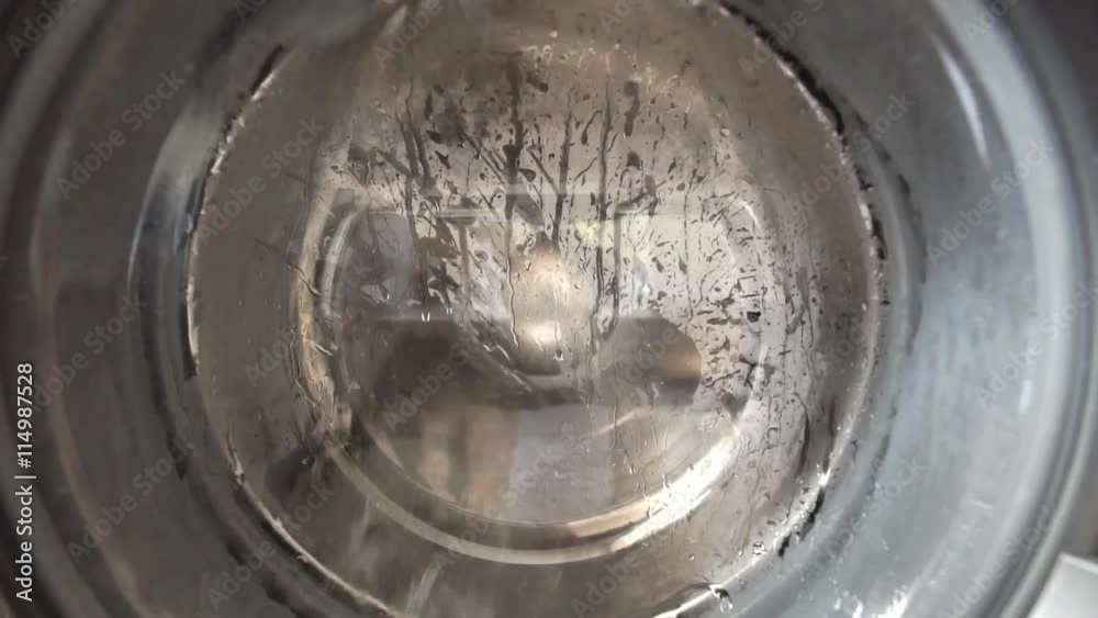 View of a washing machine drum during wash View of a washing machine drum during wash