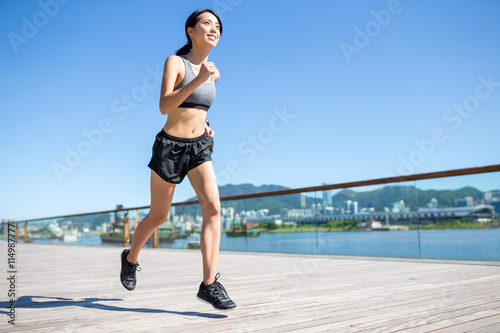 Woman running at outdoor © leungchopan