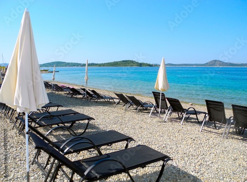 Sun loungers on the beach in Vodice.