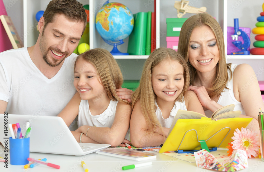 Fototapeta premium happy family with laptop