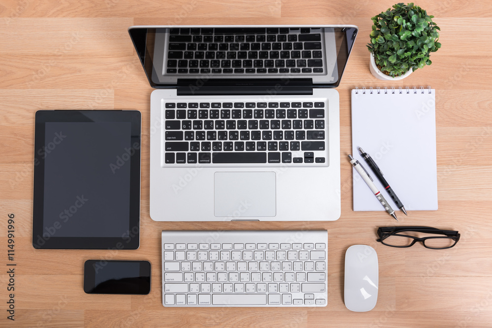 Top view open laptop with digital tablet and white smartphone Top view open laptop with digital tablet and white smartphone