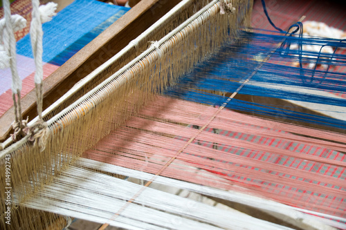 Close up Loom weaving silk in thailand
