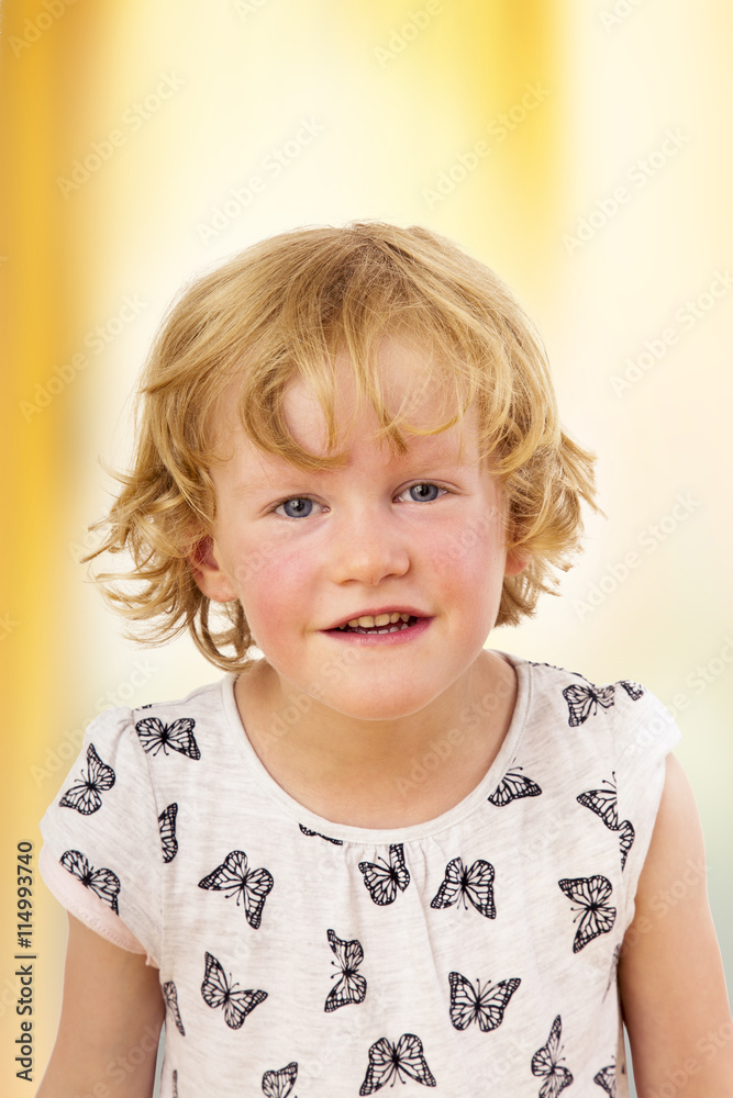 Portrait of a girl with blond hair and blue eyes