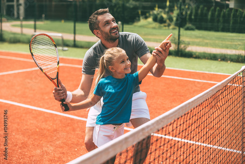 Tennis is fun when father is near.