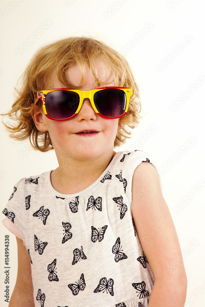 Portrait of a girl with blond hair and sunglasses Portrait of a girl with blond hair and sunglasses
