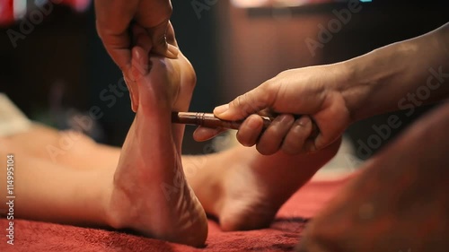 Thai massage of female foot photo