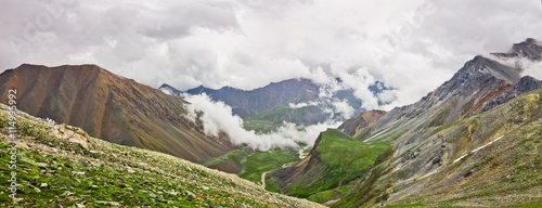 Panorama Clouds over the white marble mountains. Sayan, pomegran photo