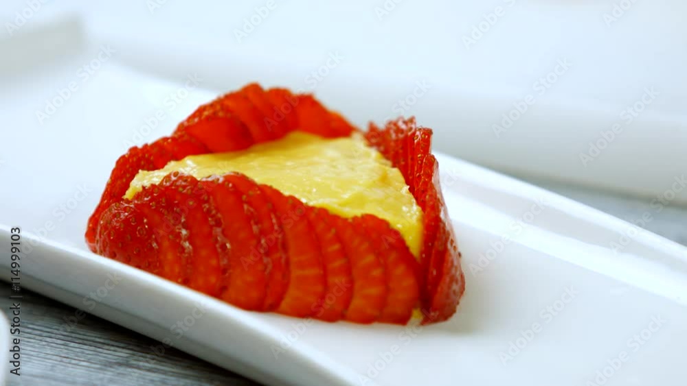 Hands touch strawberry slices. Cake with pieces of berry. Delicious flan with custard. Recipe of dessert from Europe. Hands touch strawberry slices. Cake with pieces of berry. Delicious flan with custard. Recipe of dessert from Europe.