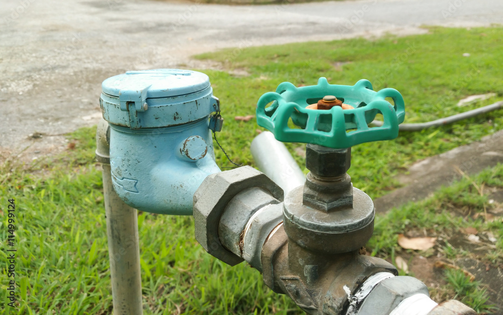 Old water valve of brass mounted connect with water meter Old water valve of brass mounted connect with water meter