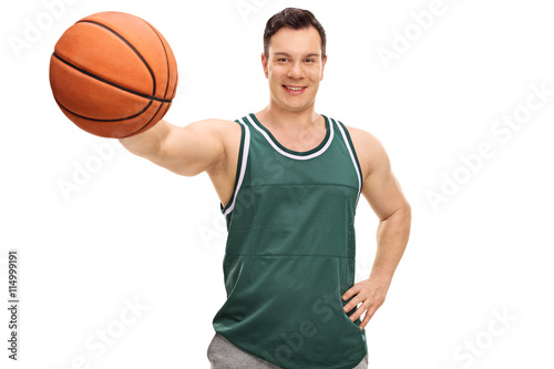 Young guy holding a basketball