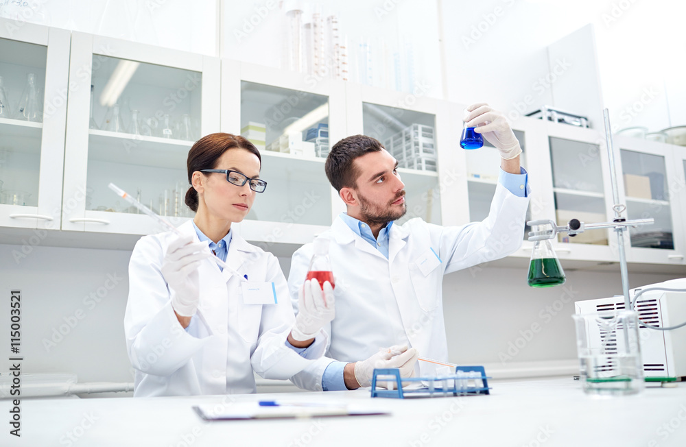 young scientists making test or research in lab young scientists making test or research in lab