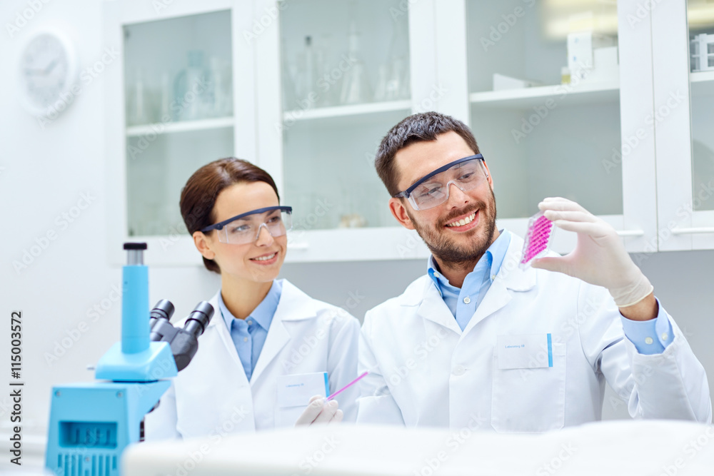 young scientists making test or research in lab young scientists making test or research in lab