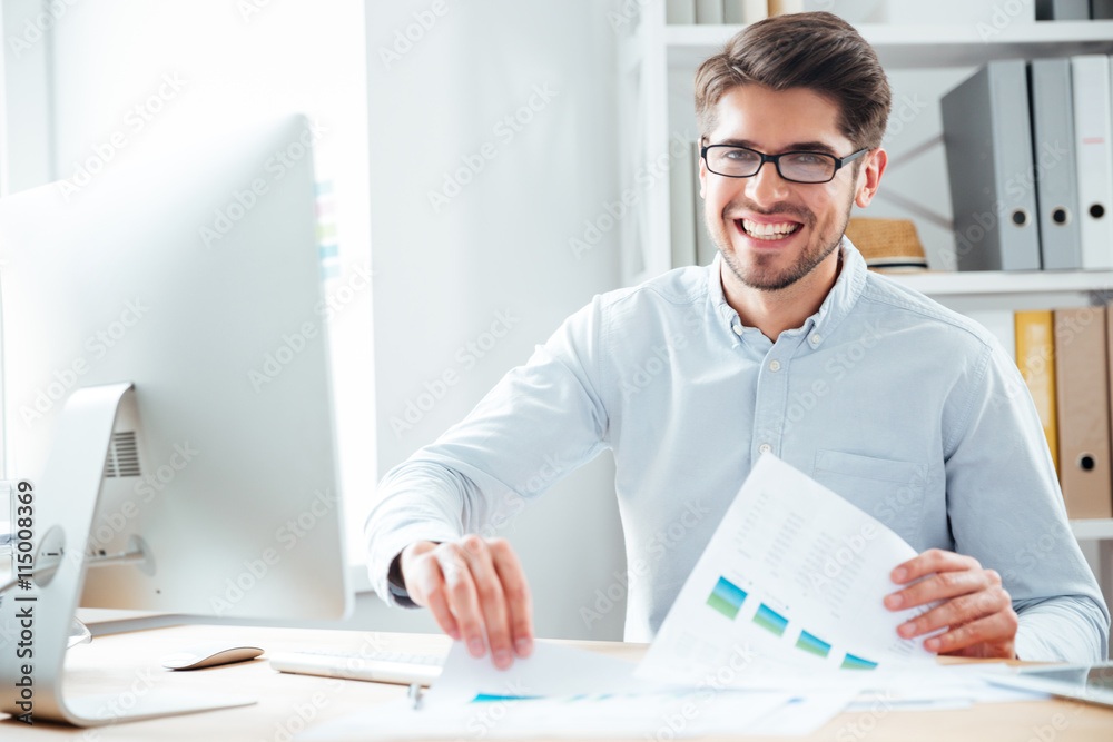 Businessman working with documents and computer in office Businessman working with documents and computer in office