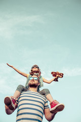 Kid and father playing outdoors