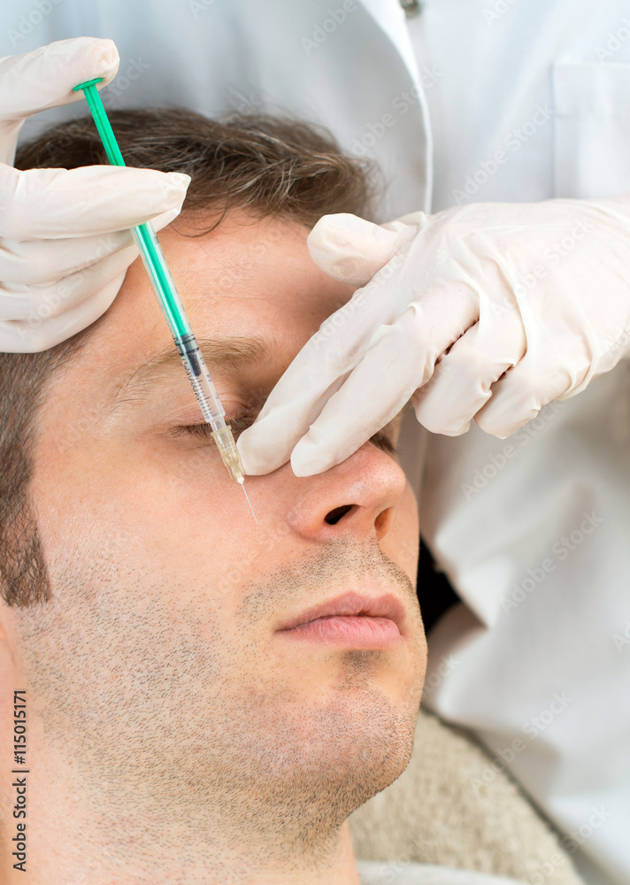 Handsome man is getting injection. Concept of aesthetic beauty. Handsome man is getting injection. Concept of aesthetic beauty.
