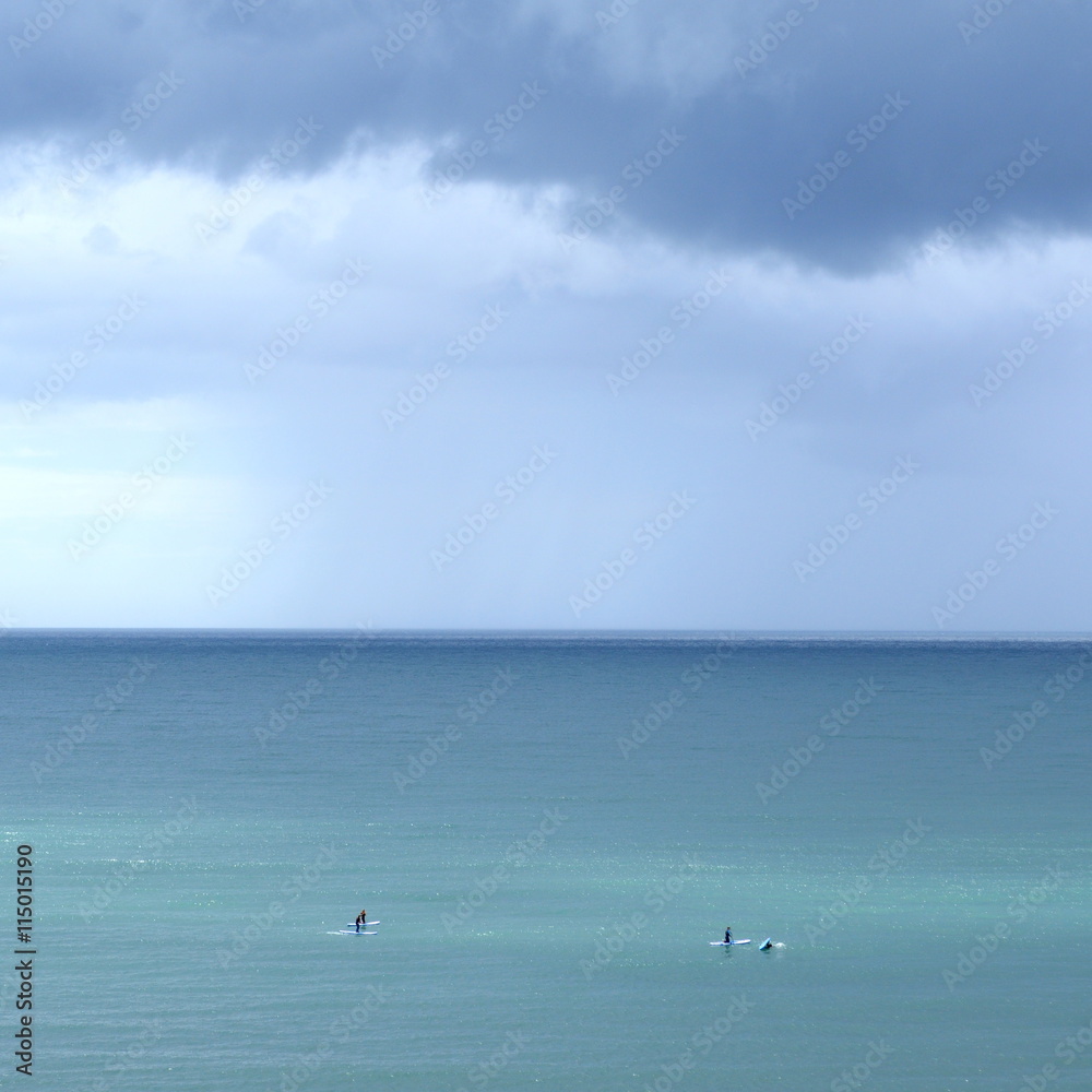 Scene fom the sea with surfers