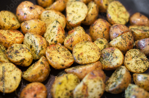 Close-up view of fried potatoes with dill.