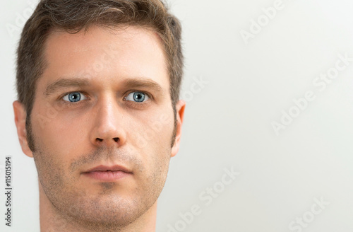 Handsome blue-eyed man portrait. Space for your text.
